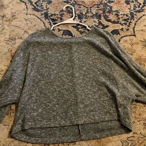 This is a cropped, flowy, stylish sweater for the winter